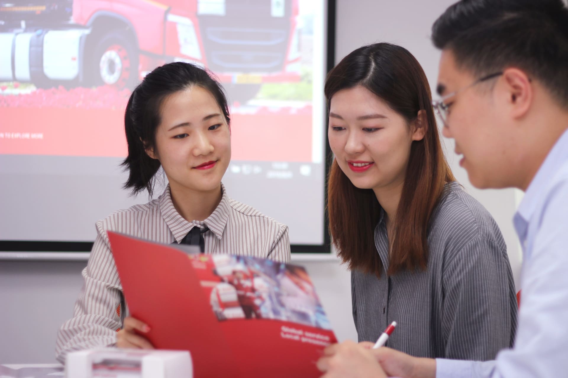 Two people having a discussion in an office