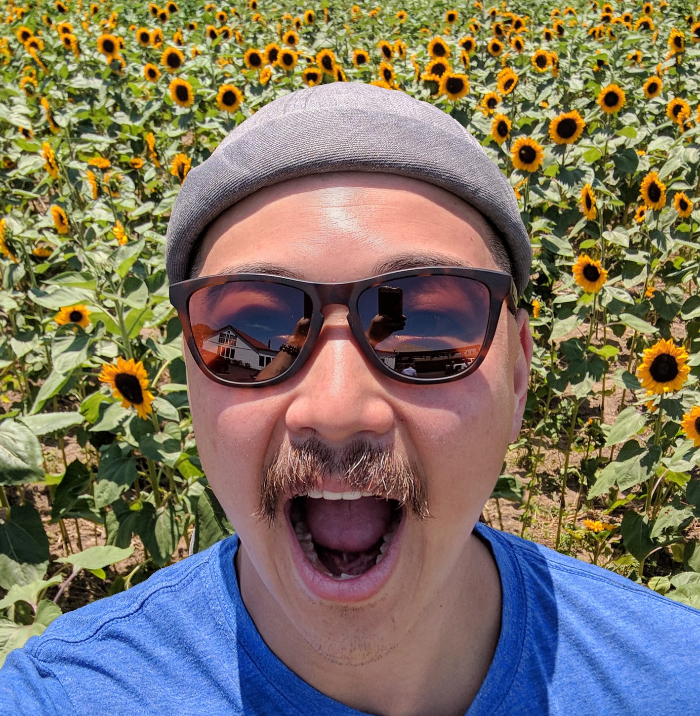 Alex in front of sunflower field