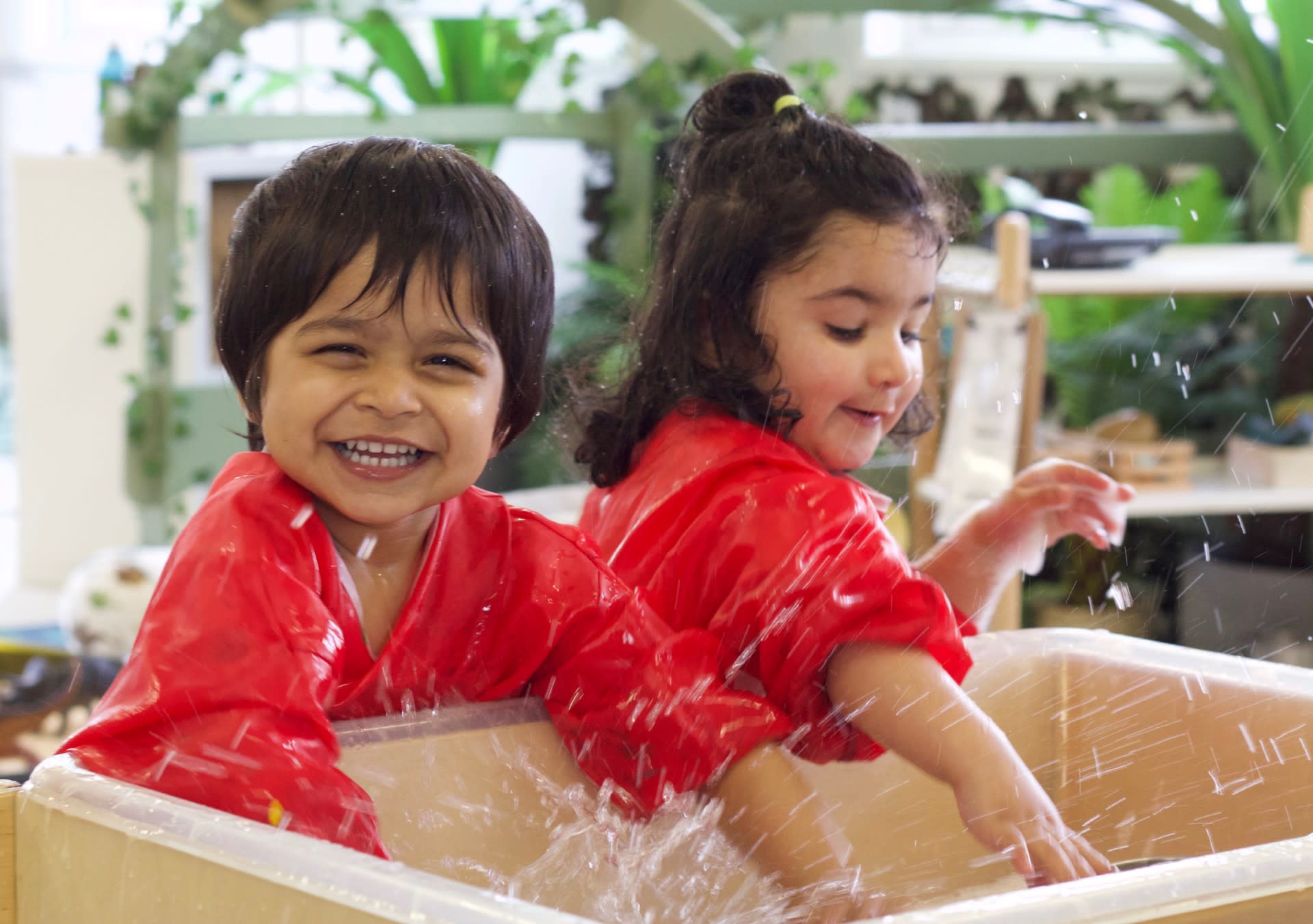 Children learning through wet play 