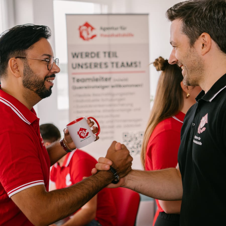 Two team members shaking hands