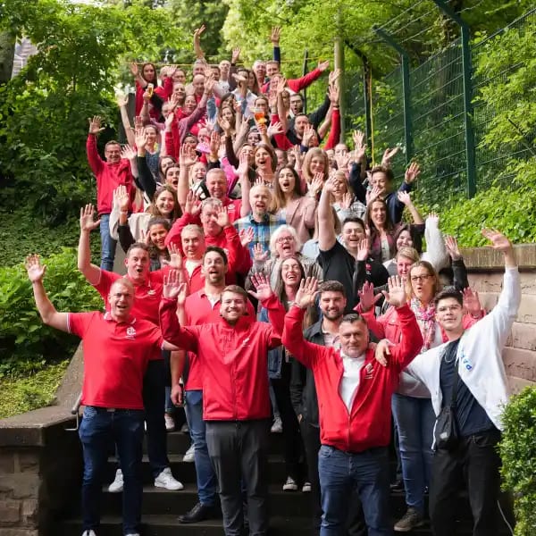 Team photo with hands up