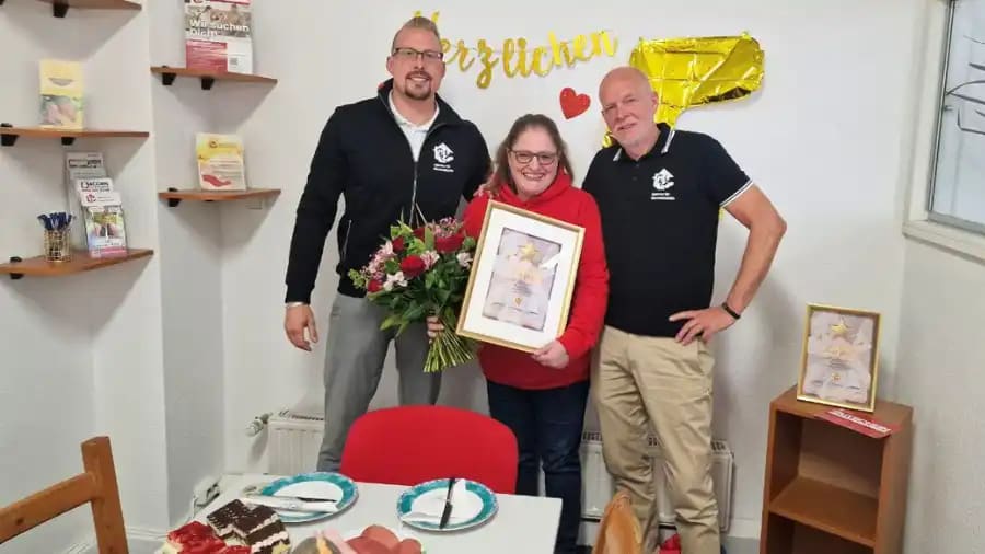 Sandra with her Outside Team Coordinator holding her certificate