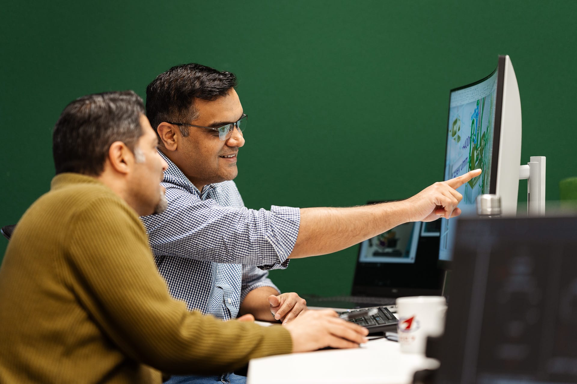 2 men at computer