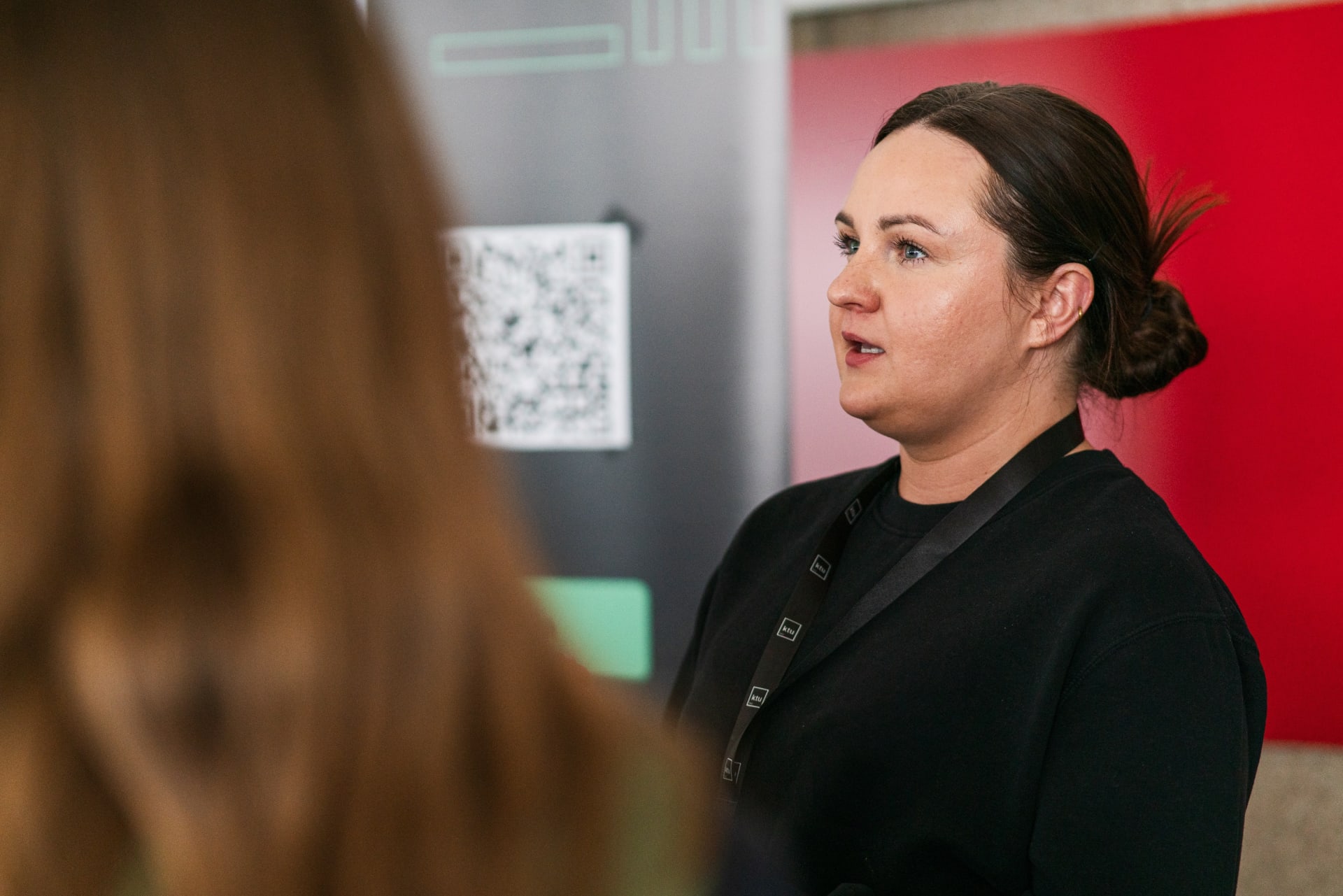 Woman talking to students
